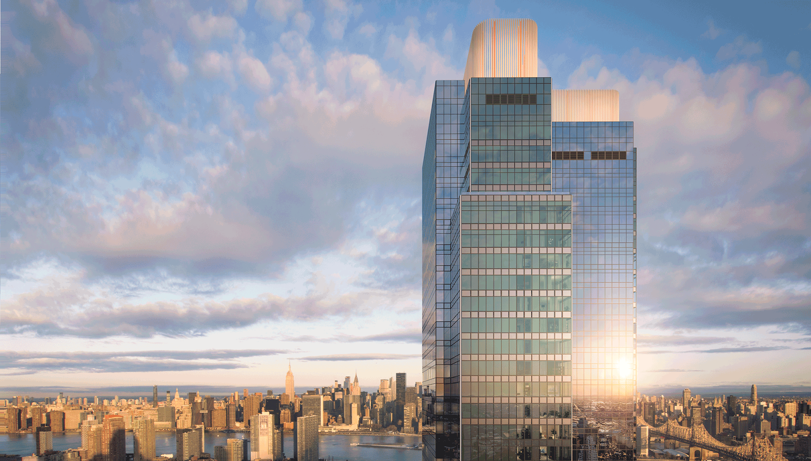 Skyline Tower in Queens, New York, rising above the Manhattan skyline at sunset