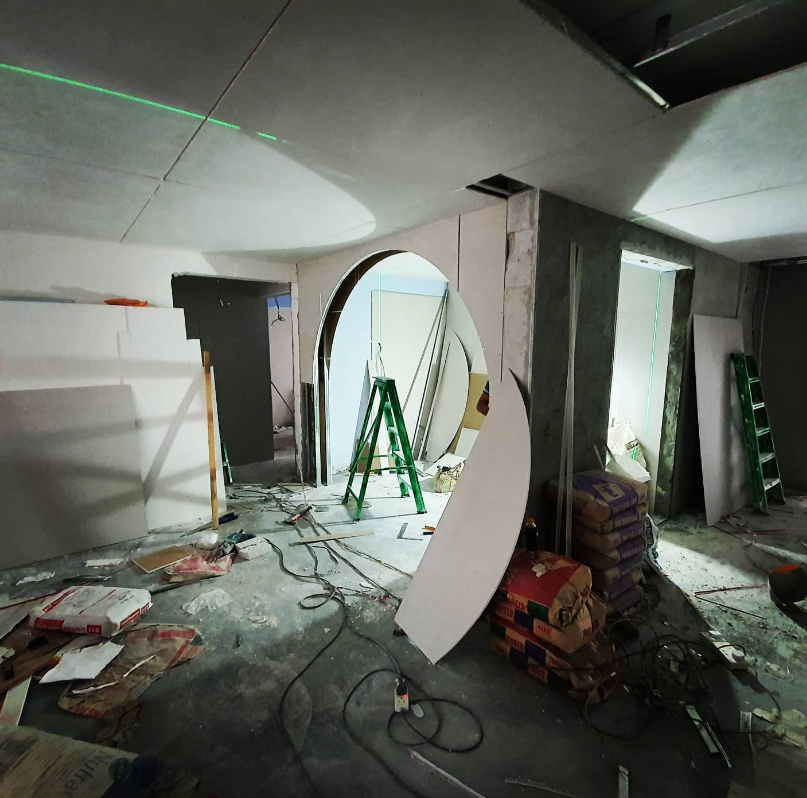 1987 HDB flat mid-renovation, with a curved arch being built into a partition wall