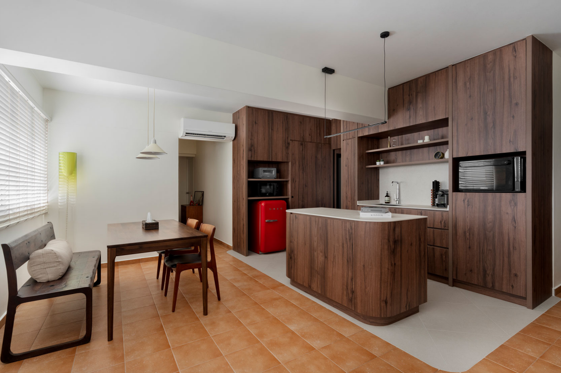 Dining area facing the dry kitchen with a wooden island in the Cantonment Close flat