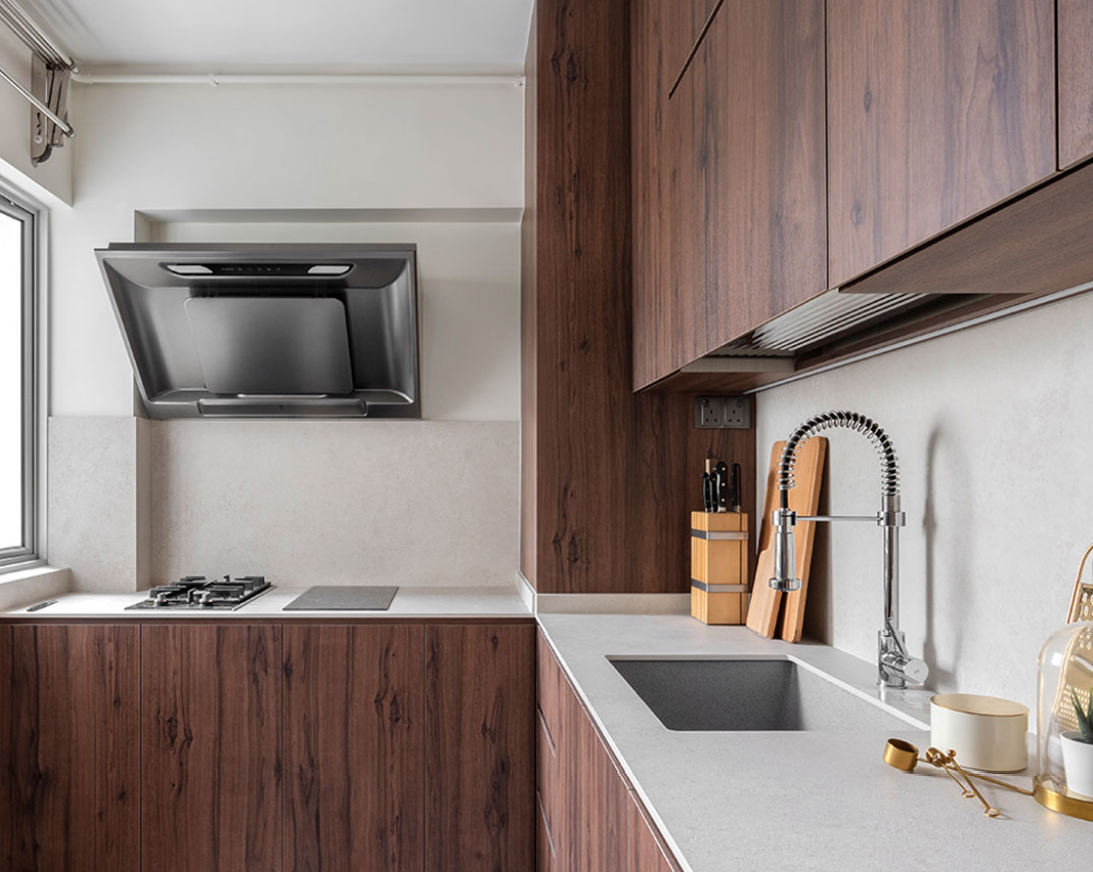 Wet kitchen with wood-grain cabinets and a grey quartz countertop