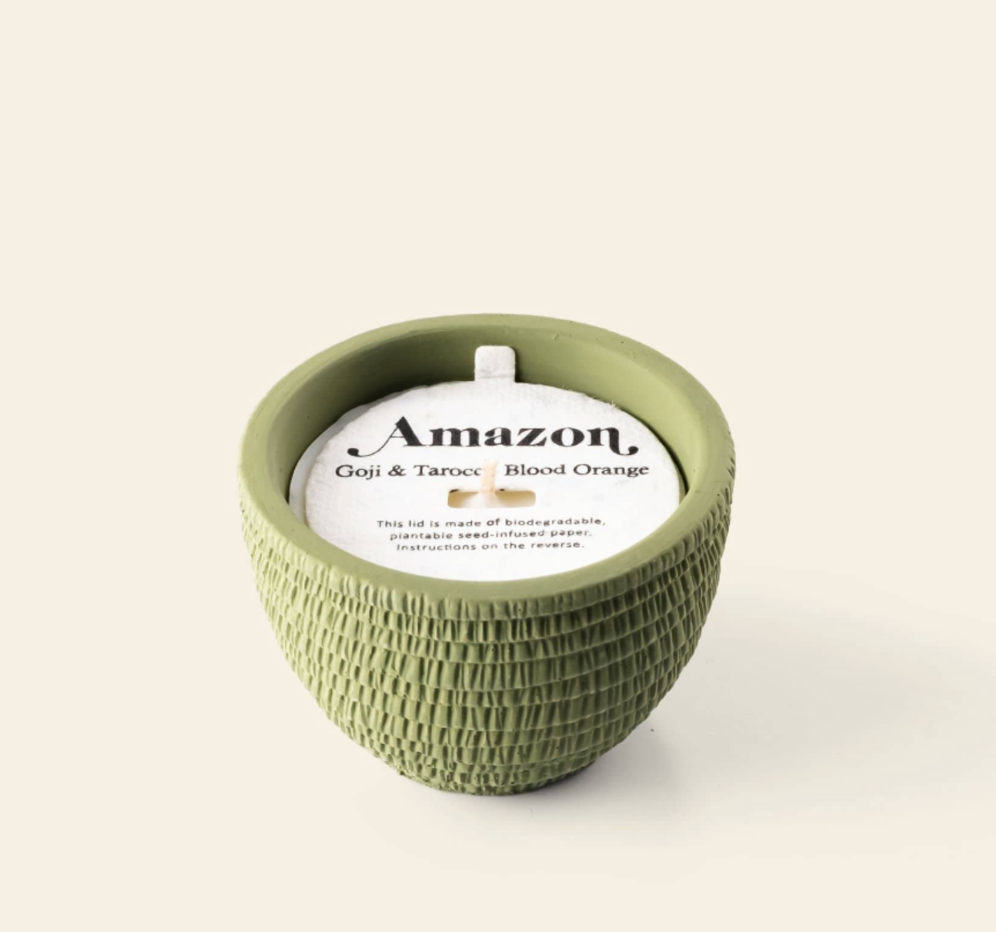 Pass It On Amazon scented candle in a green textured pot