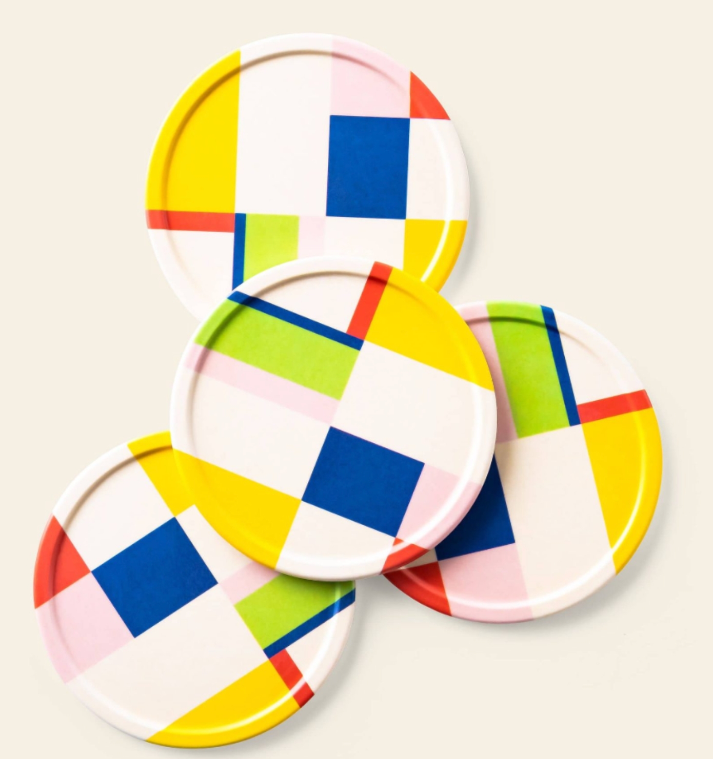 Poketo bamboo coasters with a colourful geometric pattern