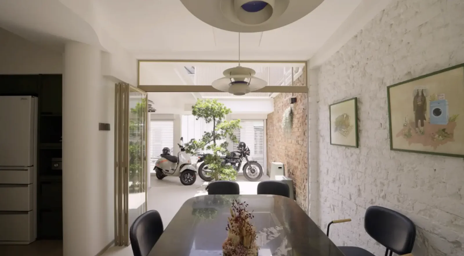 Inside A 1940s Shophouse Unit With A Rustic Motorcycle Garage 4