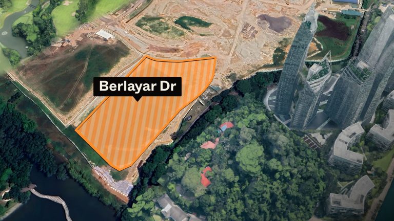 Aerial view of vacant land outlined in orange labelled Berlayar Dr next to tall buildings and greenery
