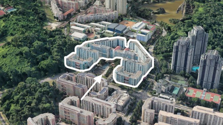 Cluster of housing blocks outlined in white surrounded by greenery and other residential buildings