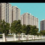 Row of tall residential apartment blocks behind trees and a white fence along a road