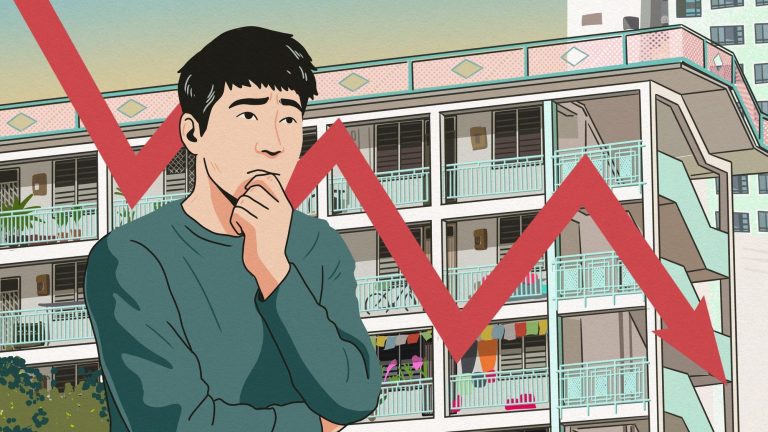 Man with worried expression standing in front of public housing block with red downward graph line
