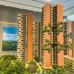Scale model of Springleaf Residence apartment blocks with greenery and interior showroom backdrop