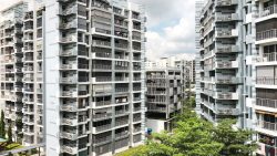 Pasir Ris ONE DBSS residential blocks with balconies and greenery under a partly cloudy sky