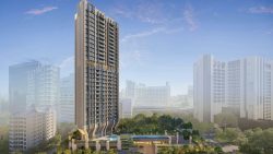 Tall private condominium block with balconies and a pool on the podium deck surrounded by greenery