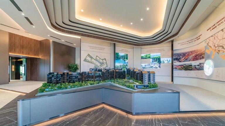 Architectural model of Terra Hill residential blocks displayed in a sales gallery with information panels on the walls