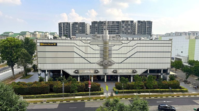 Golden Village Yishun cinema building with housing blocks and trees in the background