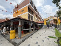Toa Payoh Central residential block with pedestrian walkway and hawker centre stalls below the building