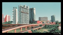 Residential buildings and a modern high-rise near a multi-level elevated expressway with greenery below