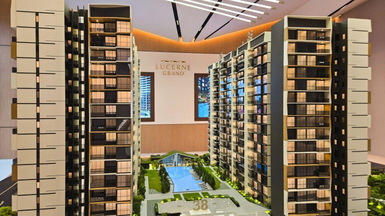 Architectural model of Lucerne Grand condominium with residential towers, pool, and clubhouse facilities