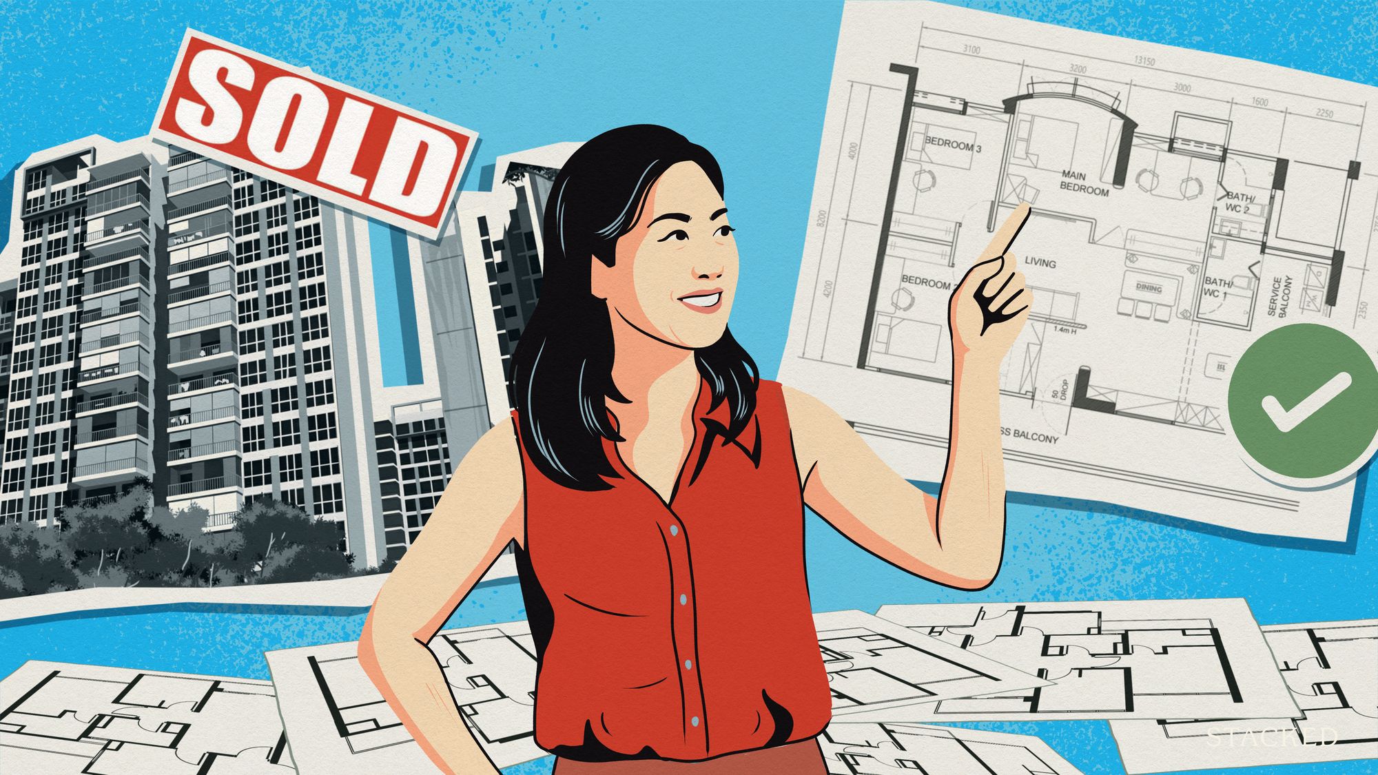 Woman pointing at a floor plan with apartment blocks and a sold sign in the background