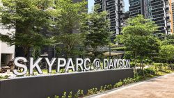 SkyParc @ Dawson signboard with greenery and residential blocks in the background