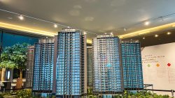 Architectural model of Parc Clematis residential blocks with detailed balconies and windows in a showroom setting
