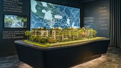 Model of Jervois Mansion residential blocks with a map and text about living well on the wall behind