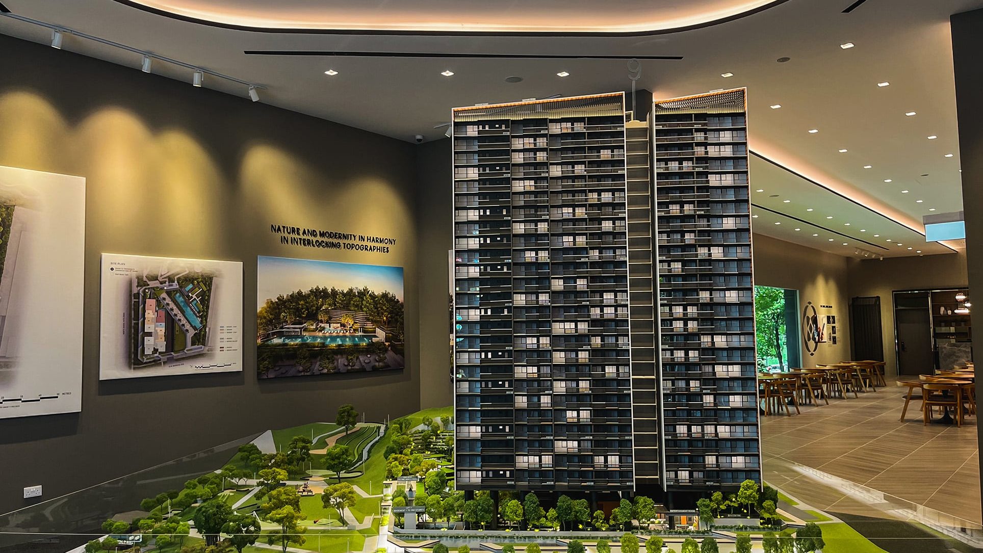 Scale model of Blossoms by the Park showing high-rise blocks and landscaped grounds inside a showroom
