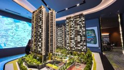 Architectural model of Pinetree Hill residential blocks with surrounding landscaped gardens and amenities indoors