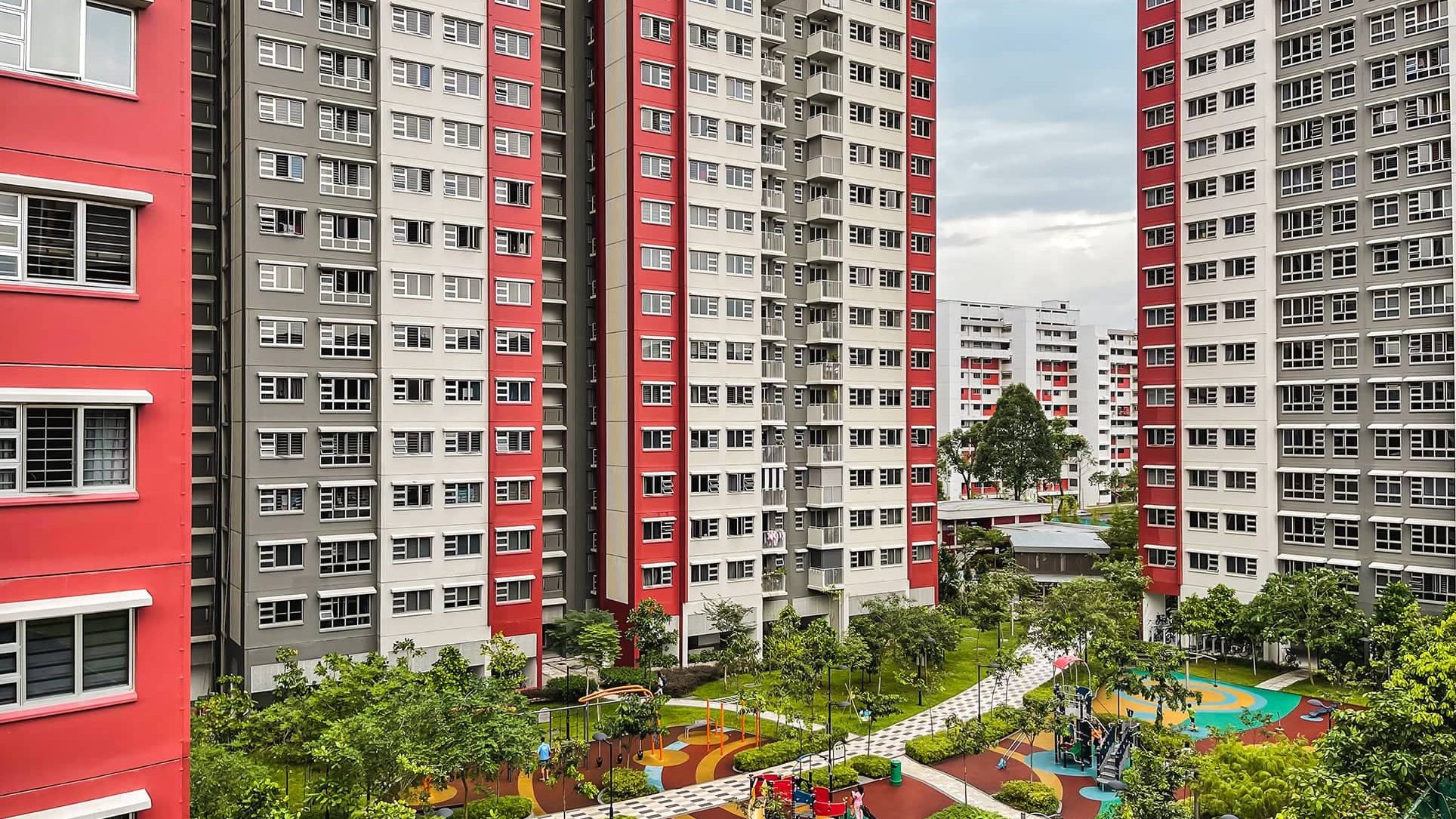 Multi-storey Ang Mo Kio Court blocks with playgrounds and landscaped gardens in between