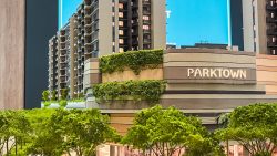 Parktown Residence apartment blocks with greenery on facade and surrounding trees