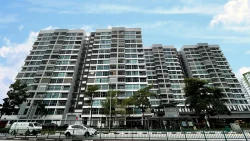 Centrale 8 DBSS residential blocks with trees and vehicles under a blue sky