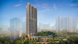 Tall modern residential tower with balconies surrounded by greenery and nearby high-rise buildings under blue sky