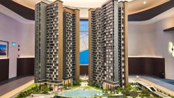 Model of Vela Bay residential blocks with swimming pool and landscaped gardens in showroom