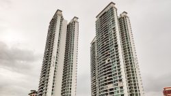 Natura Loft Bishan DBSS twin residential towers against an overcast sky with balconies and windows