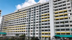 Fajar/Saujana HDB Estate (1980s) residential blocks with yellow accents under a blue sky