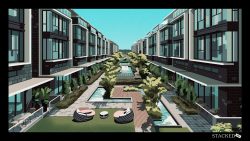 Row of modern three-storey terrace houses facing a landscaped central garden with pools and seating areas