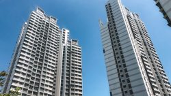 Bendemeer Light residential blocks against a clear blue sky with some greenery visible at the bottom left