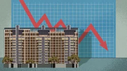 Row of brown housing blocks in front of a blue graph with a red downward zigzag arrow