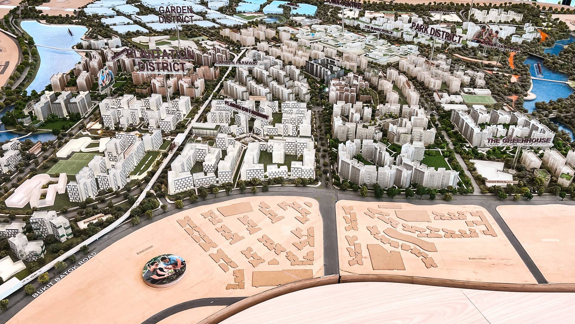 Detailed architectural model of a large residential town with labelled districts and waterways
