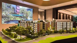 Detailed architectural model of Watten House showing multiple six-storey residential blocks and landscaping