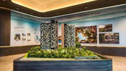 Scale model of Nava Grove residential blocks with lush landscaping displayed indoors at a sales gallery