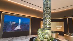 Model of Newport Residences freehold condominium tower with landscaping and balconies inside sales gallery