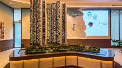 Skye At Holland three high-rise residential towers with greenery base displayed on model table in showroom