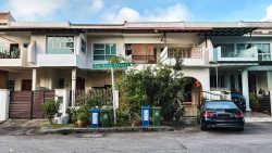 Two-storey terraced houses with tiled roofs, balconies, plants and a street sign for Tai Hwan Terrace
