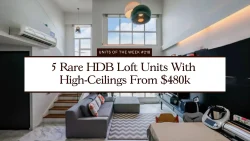 Living area of an HDB loft unit with grey sofa, geometric rug, high ceilings and large windows