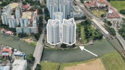 Cluster of high-rise residential blocks outlined and highlighted in a suburban area near a river and MRT station