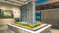 Scale model of Twin VEW residential towers with surrounding landscaping in sales gallery room