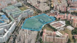 HDB blocks and open field with blue outline in dense residential area with various building types