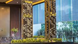 Detailed architectural model of Irwell Hill Residences with two high-rise towers and surrounding greenery