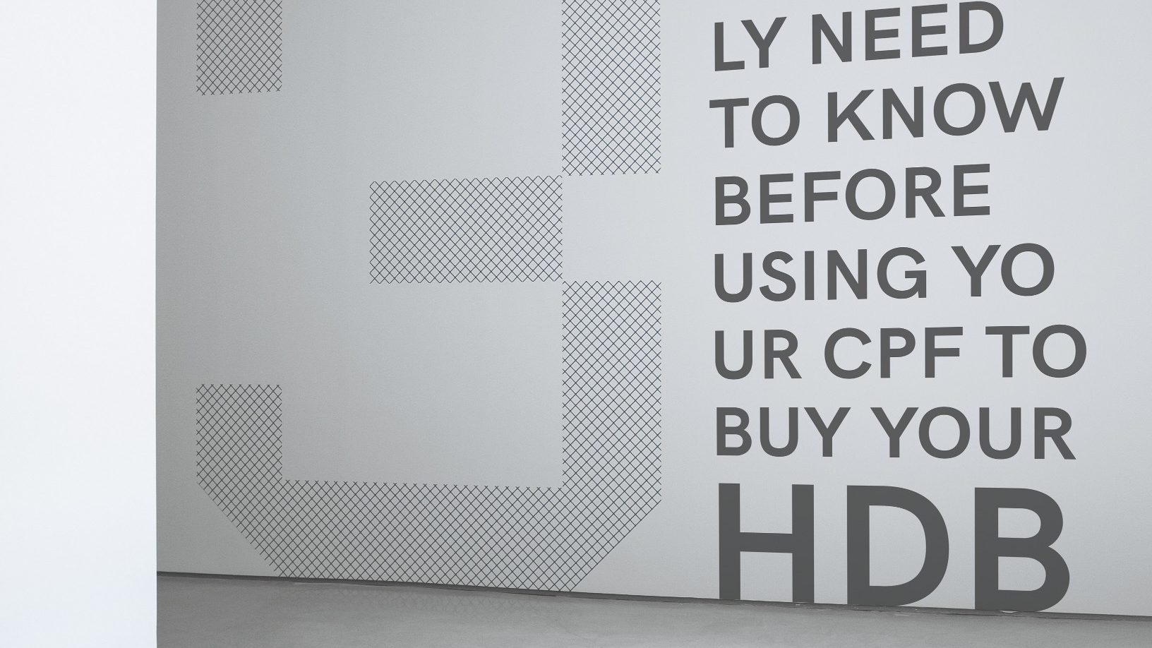Wall text reading "What you really need to know before using your CPF to buy your HDB" with a patterned design on left