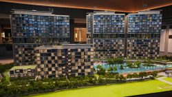 Lentor Gardens Residences model with multiple apartment blocks surrounding a central swimming pool and landscaped greenery