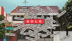 Two-storey landed house with many price tags and a large red SOLD sign overlaid