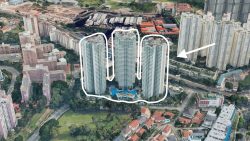 High-rise residential towers with a swimming pool outlined and an arrow pointing towards adjacent housing blocks